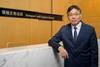 The picture shows Mr Lam Sai-hung standing facing the camera