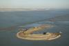 The value of the new port infrastructure must be weighed against the natural capital of the surrounding ecosystem. The Ilot bird island sanctuary at the mouth of the Seine near Le Havre Port 2000 was created to compensate for natural habitats lo...