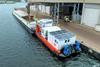 Picture shows the E-Pusher 1 in operations for emission free cacao transport in Amsterdam harbour