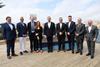 The image shows a crowd of signatories to the shore power agreement including Robert Abela, PM of Malta and representatives from Valletta Cruise Port and Global Ports Holdings, Transport Malta and Carnival Corps