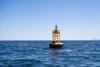The image shows MarineLabs monitoring technology attached to a harbour buoy