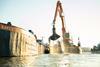 The image shows the Van Oord dredger Christiaan P during the pilot project
