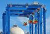 The image shows the Konecranes hybrid RTGs already in operation at OPCSA
