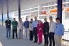 The image shows Ana Arévalo, head of the shorepower department at the Port of Barcelona, with several members of her team, the manager of the MSC terminal, Sandra Yunta, and Peter Castberg with the PowerCon team in charge of developing the project