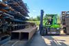 The image shows the Combi-CB70E at work in a yard