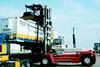 Svetrucks 50150-57 with piggyback and combined 20-40 spreader attachment for handling containers and trailers