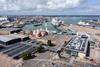 The image shows an overhead shot of ferries berthing at Portsmouth International Port