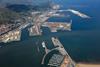 The image shows an overhead shot of the Port of Bilbao