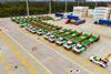 The image shows an overhead shot of the Sany electric terminal tractors in the terminal yard