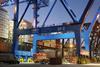 Florida International Terminal at night showing a crane and cargo containers