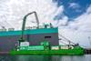 Green STAX vessel capturing carbon at a port