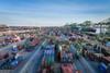 The image shows an overall view of container handling at the Port of Tianjin