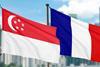 Picture shows the French and Singaporean flag flying at the port