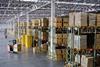 warehouse-with-stacked-boxes-and-pallet-truck-drivers