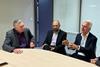 The image shows the GPC 2025 chairs in discussion round a table
