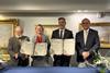 The ports’ CEOs and board members celebrate the MOU