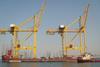 April_PS_UAE_Khorfakkan_fully_erect_cranes_arrive_by_barge.jpg