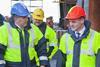 Lyttelton CEO Peter Davie shows New Zealand acting Prime Minister Bill English (right) how repairs to earthquke-hit port infrastructure are progressing