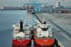 The image shows the ammonia bunkering pilot between two vessels at a terminal in the Port of Rotterdam