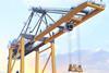 An AI image of a ship-to-shore crane surrounded by containers