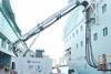 The image shows a Cavotec shore power system in action