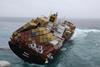 Containers from the stricken Rena have been spotted off and removed off the Port of Tauranga. Image: Mark Alen