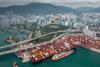 The image shows an overhead shot of the bunkering operation at the Port of Hong Kong