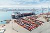 aerial shot of CNMP LH Atlantique with containers portside and cranes loading a cargo ship