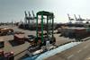 The hydrogen straddle carrier pictured on the quayside at Container Terminal Tollerort