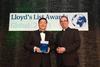 Davis Lian, President of Evergreen Shipping Agency (U.K.) (left) accepts the Environment Award from Reverend Richard Coles (right)