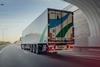 The image shows a Girteka cargo truck on the road