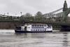 Emerald of London pleasure boat stuck under Hammersmith Bridge on the River Thames