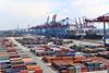 The image shows containers on a quayside in Germany