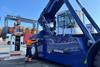 The image shows Sany's electric reach stacker at BEST