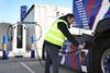 An image of a person charging an electrical HGV at the Tilbury eHGV charing hub
