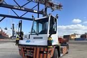 An autonomous terminal tractor driven by Oxa’s self-driving technology, shown quayside at Port of Tyne