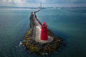 Great South Wall Dublin Port with red lighthouse at the end