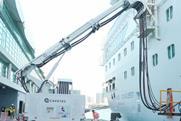 The image shows a Cavotec shore power system in action