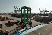 The hydrogen straddle carrier pictured on the quayside at Container Terminal Tollerort