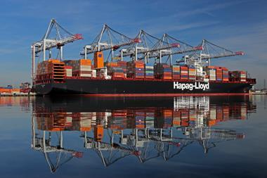 Hapag-Lloyd container ship at the Port of Southampton with five ship-to-shore cranes in the background