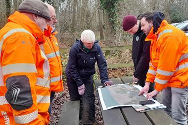 The image shows the BUDS project team in discussion