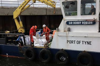 A  view of the pellets being collected and loaded onboard port vessels