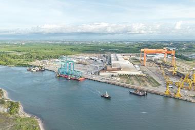 The image shows the new electric port equipment on the quayside