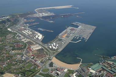 The image shows an aerial shot of the Port of Gijón