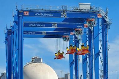 The image shows the Konecranes hybrid RTGs already in operation at OPCSA