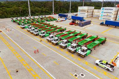 The image shows an overhead shot of the Sany electric terminal tractors in the terminal yard