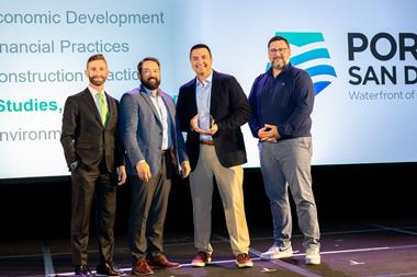 The image shows Michael LaFleur, Vice President of Maritime and Ernesto Medina, Chief Engineer at the Port of San Diego receiving their award from Cary Davis, President and CEO of the AAPA