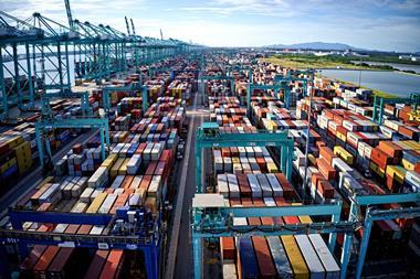 The image shows an aerial view of The Port of Tanjung Pelepas