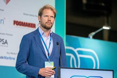 The image shows Sjoerd de Jager, managing director of PortXchange on the podium at TOC