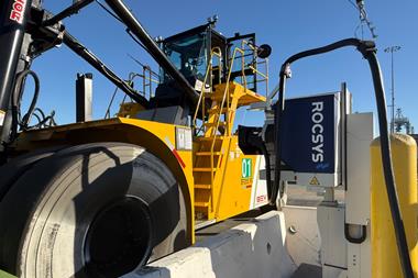 The image shows the Taylor Machine Works container handler on charge at Long Beach